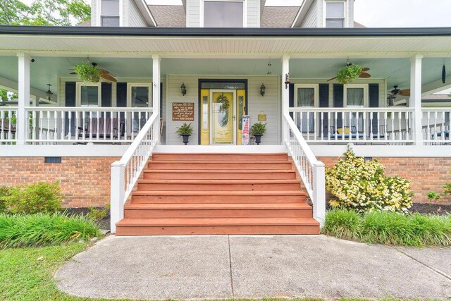 view of exterior entry featuring a porch