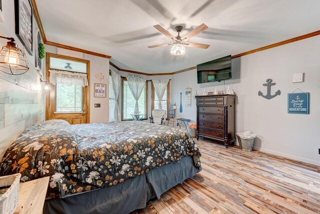 bedroom with light hardwood / wood-style floors, ceiling fan, and crown molding