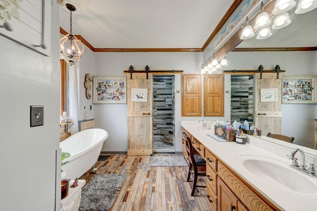 bathroom featuring ornamental molding, vanity, separate shower and tub, hardwood / wood-style flooring, and a notable chandelier