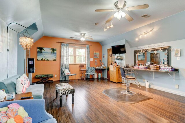 living room featuring ceiling fan, wood-type flooring, and lofted ceiling