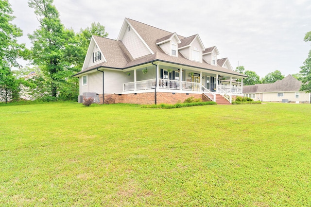 view of front of home with covered porch and a front yard