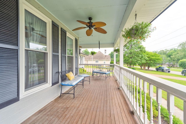 wooden deck with ceiling fan and covered porch