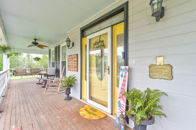 deck featuring ceiling fan and a porch