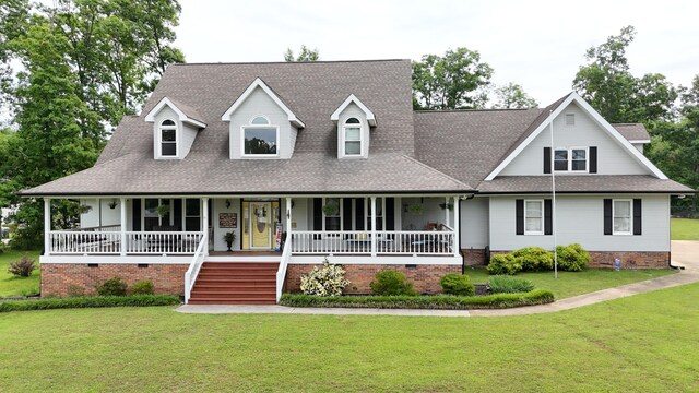 view of front of house with a front yard and a porch