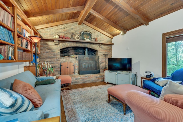 living room featuring hardwood / wood-style floors, lofted ceiling with beams, wooden ceiling, and a brick fireplace