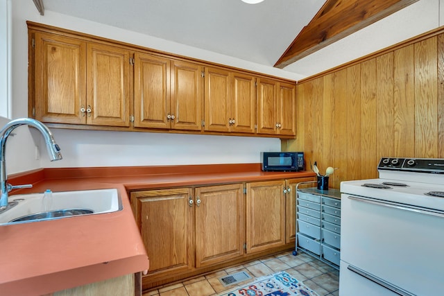 kitchen featuring white electric range, lofted ceiling, sink, and light tile patterned flooring