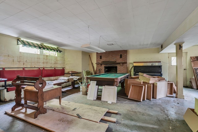 playroom featuring pool table, a wealth of natural light, and a fireplace