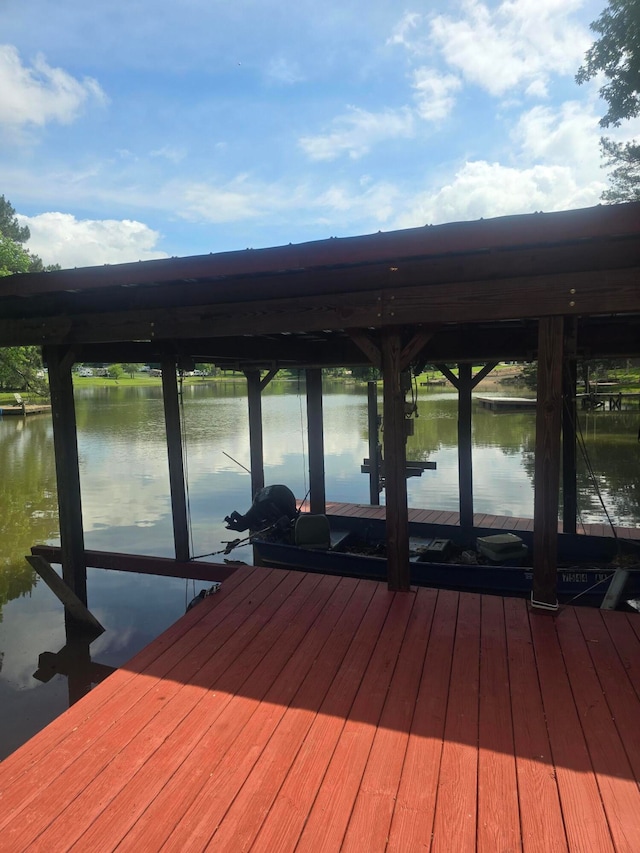 dock area with a water view