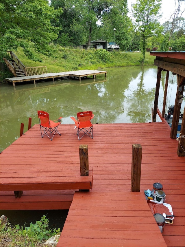 dock area with a water view