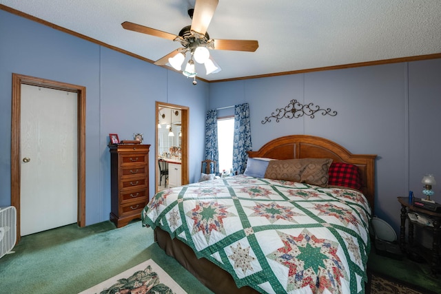 carpeted bedroom with ensuite bath, a textured ceiling, ceiling fan, and ornamental molding