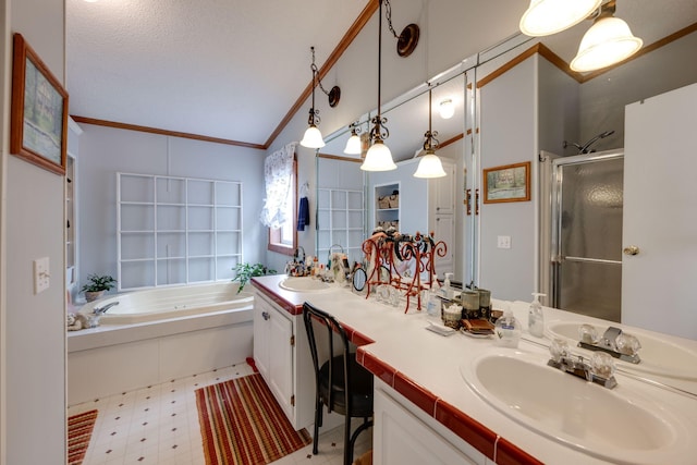 bathroom with ornamental molding, vanity, vaulted ceiling, and independent shower and bath