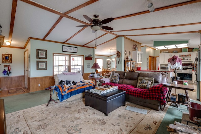 living room with ceiling fan with notable chandelier, wooden walls, a textured ceiling, and vaulted ceiling