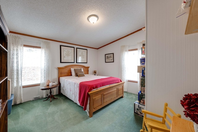 carpeted bedroom with lofted ceiling, a textured ceiling, and crown molding