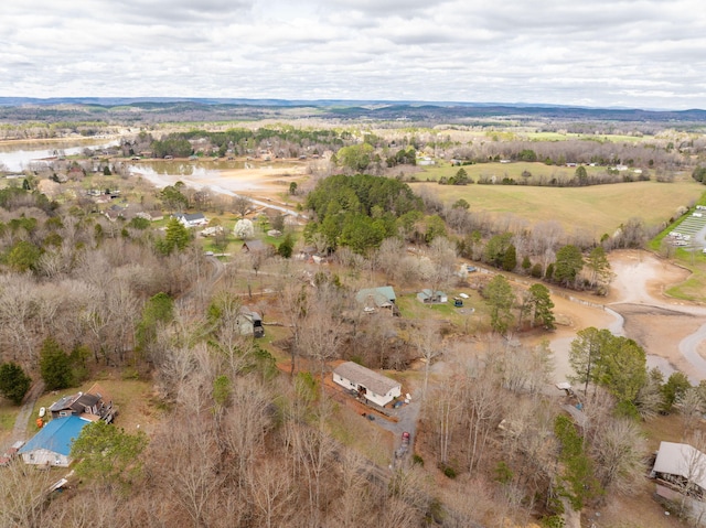 birds eye view of property with a rural view