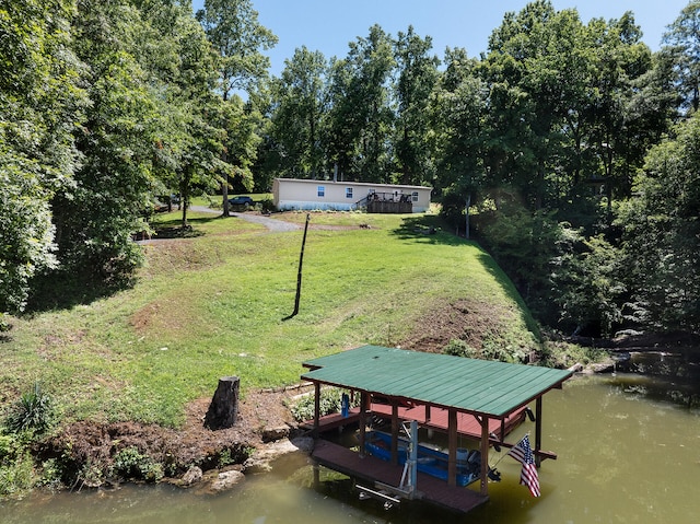 exterior space with a boat dock and a water view