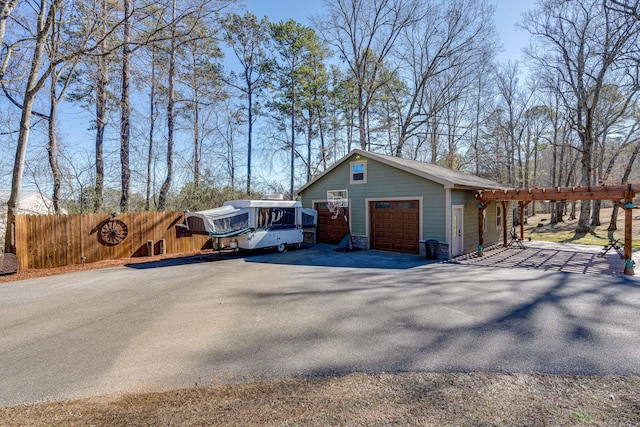 view of side of home featuring an outdoor structure and a garage