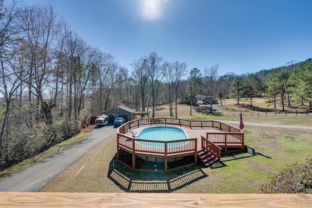 surrounding community featuring a yard and a deck