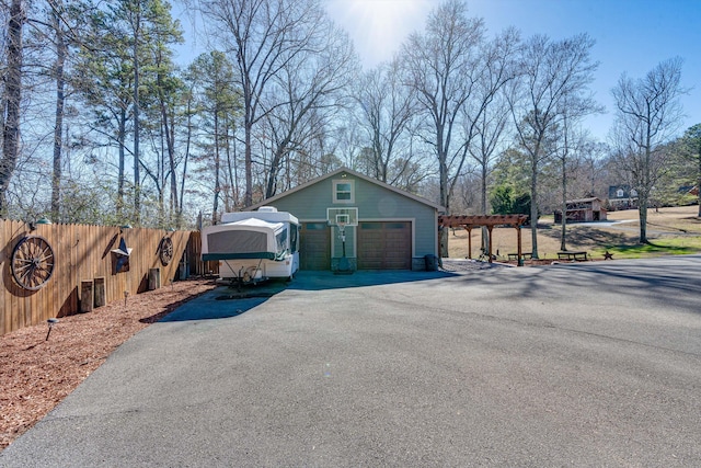 view of home's exterior featuring an outdoor structure and a garage