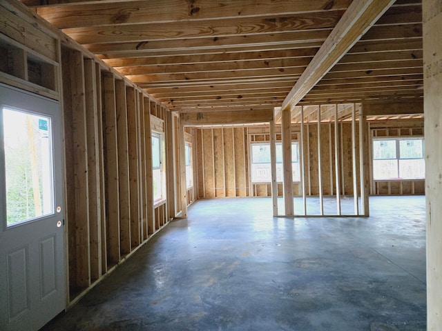 misc room featuring plenty of natural light and concrete flooring