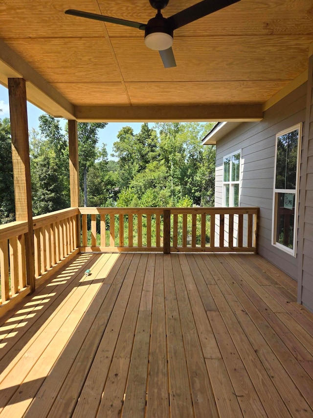 wooden terrace featuring ceiling fan