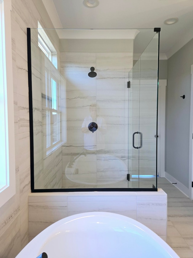 bathroom with a shower with door