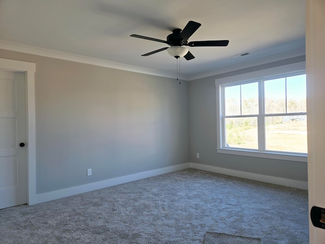 unfurnished room with carpet floors, ceiling fan, and crown molding