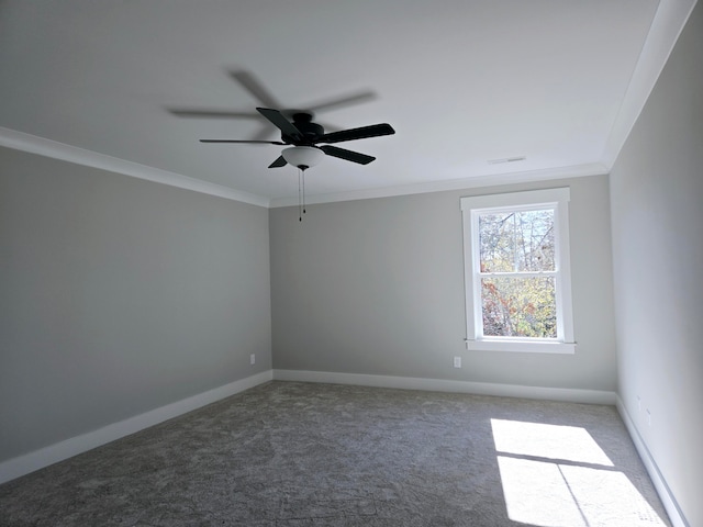 carpeted empty room with ceiling fan and ornamental molding