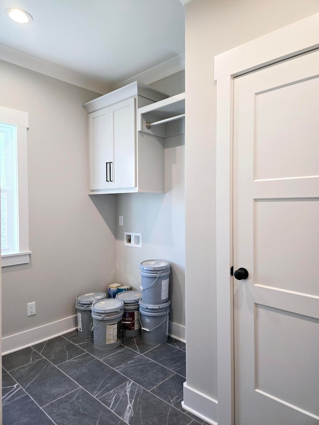 laundry room with washer hookup, hookup for an electric dryer, cabinets, and ornamental molding