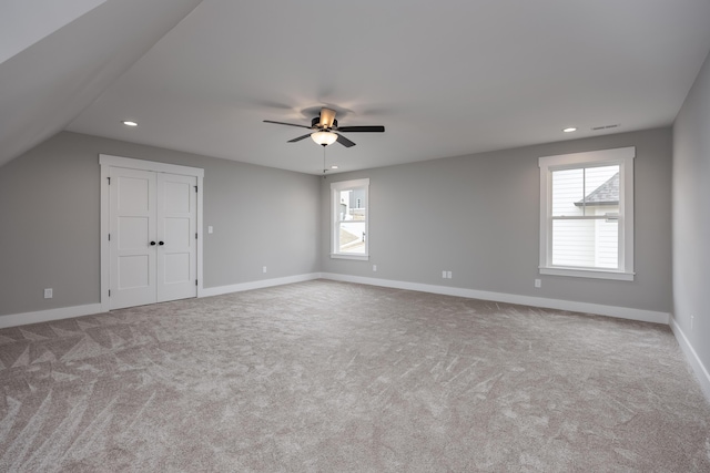 interior space with recessed lighting, baseboards, lofted ceiling, and ceiling fan