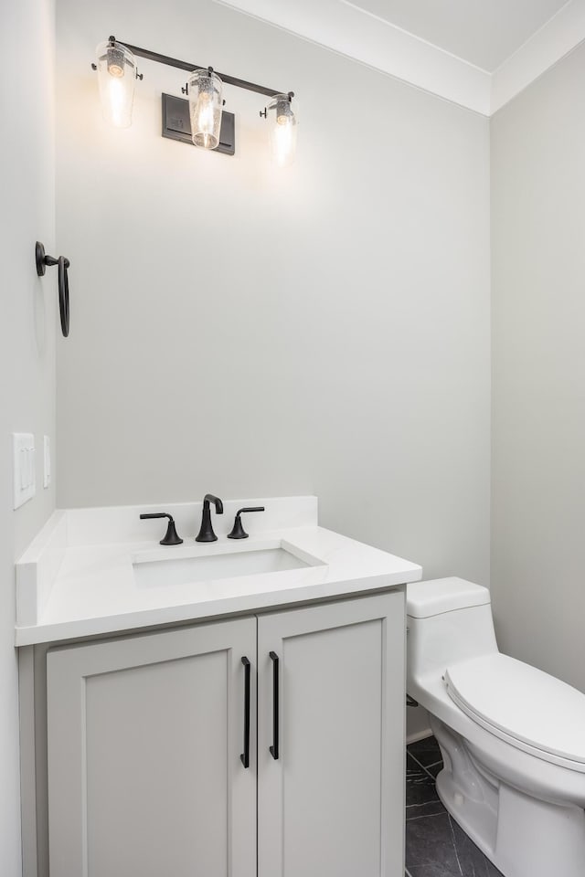 bathroom with vanity and toilet