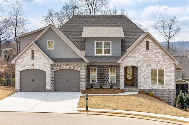 view of front of home with a garage, brick siding, driveway, and a shingled roof