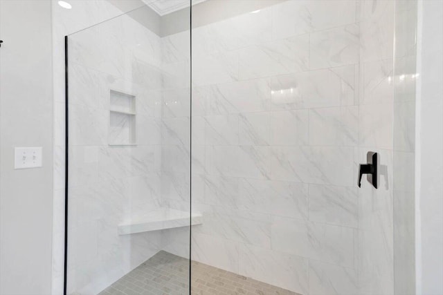 bathroom with a tile shower