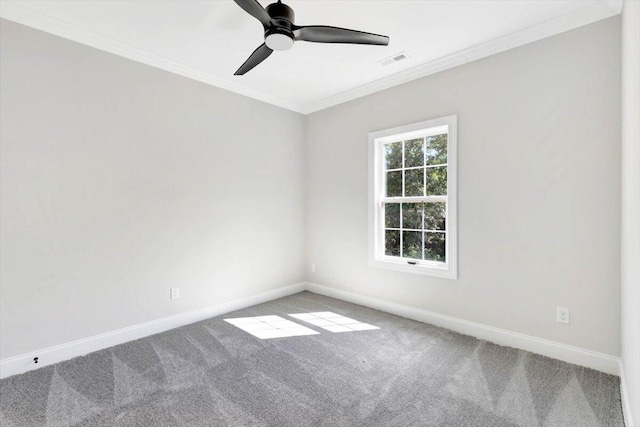 carpeted empty room featuring crown molding and ceiling fan