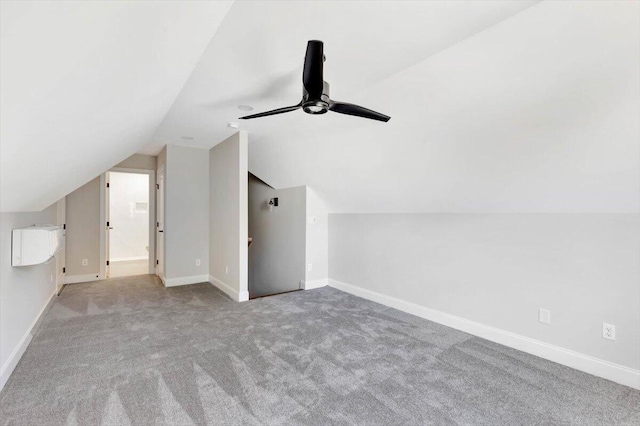 bonus room with light colored carpet, vaulted ceiling, and ceiling fan