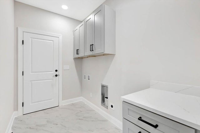 laundry room with hookup for a washing machine, cabinets, and electric dryer hookup