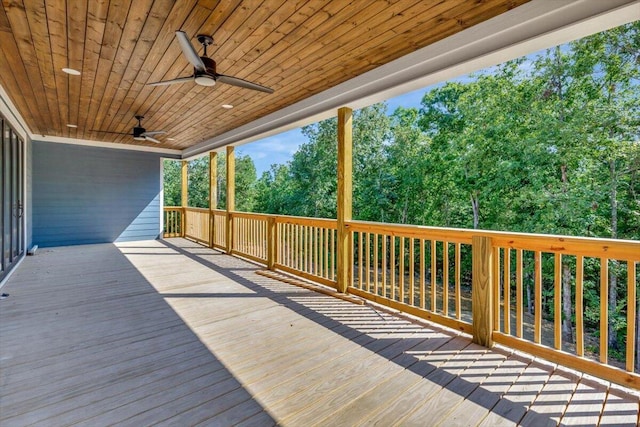 wooden deck featuring ceiling fan