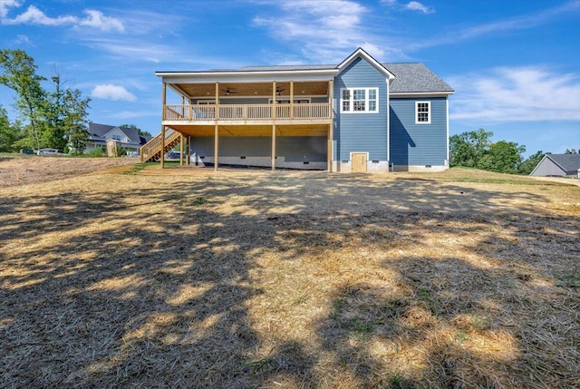 back of property with a wooden deck