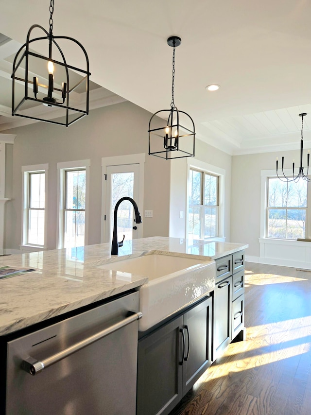 kitchen featuring dishwasher, plenty of natural light, and sink