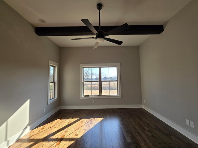 empty room with dark hardwood / wood-style flooring, beam ceiling, and ceiling fan