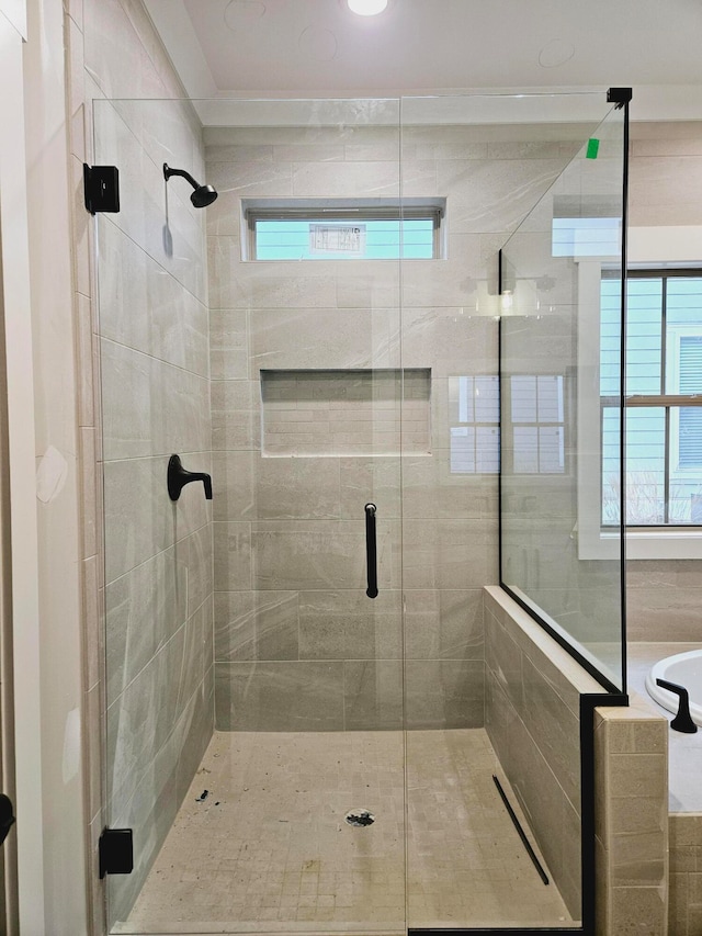 bathroom with a healthy amount of sunlight and an enclosed shower