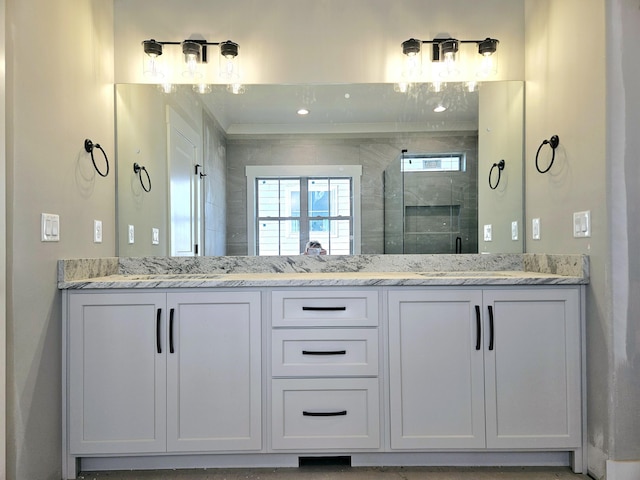 full bathroom featuring a sink and a shower stall