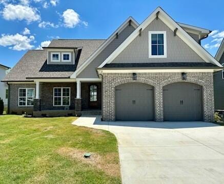 craftsman-style house with a garage and a front yard