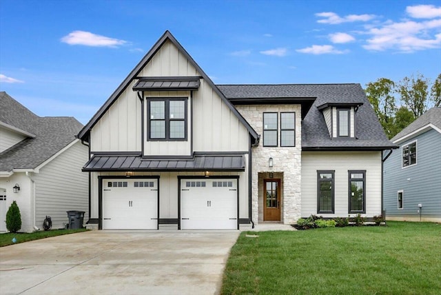 modern farmhouse featuring a front lawn and a garage