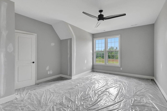 interior space with ceiling fan