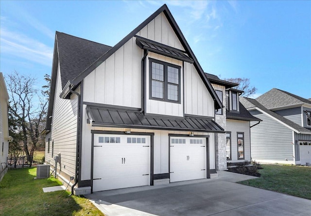 modern farmhouse featuring a garage, central AC, and a front lawn