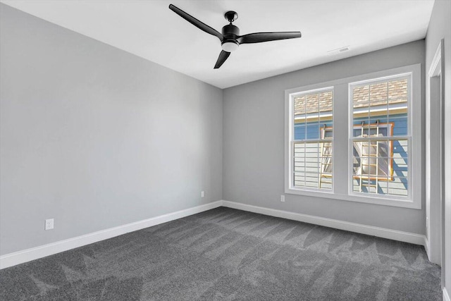 carpeted spare room with ceiling fan