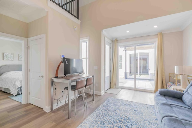 living room featuring a wealth of natural light and light hardwood / wood-style floors