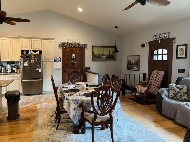 dining area featuring lofted ceiling, light hardwood / wood-style flooring, and ceiling fan