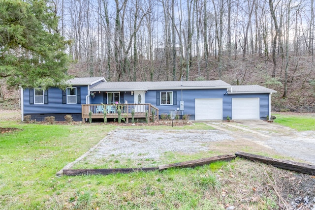 single story home with a garage, a front yard, and a deck