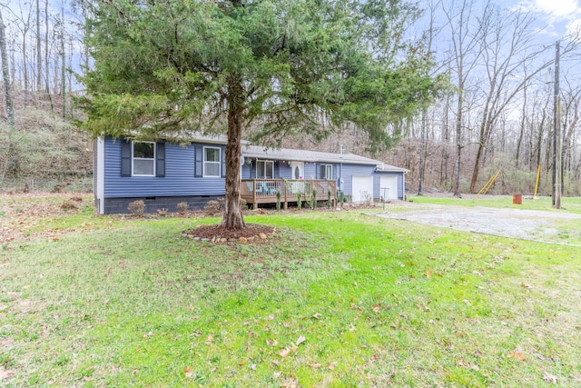 view of front facade with a front yard and a deck